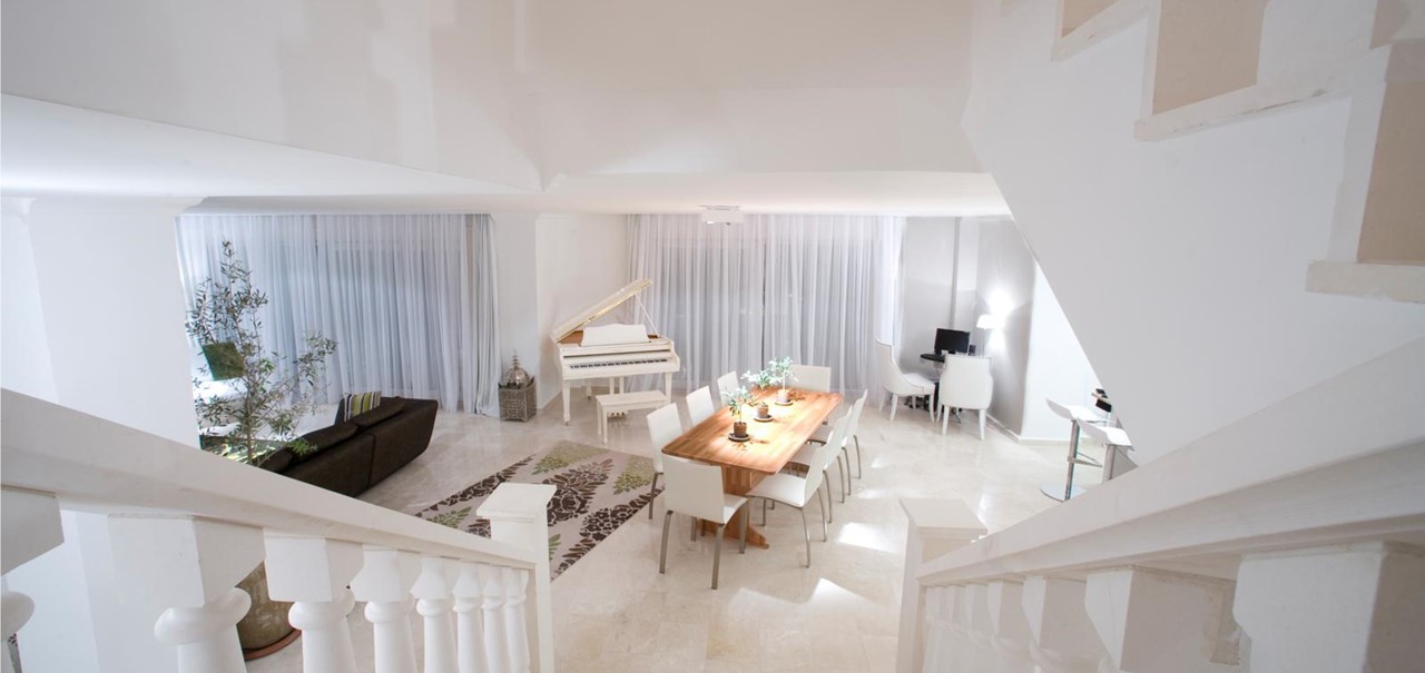 Stairs lead down to the open plan lounge, diner and kitchen